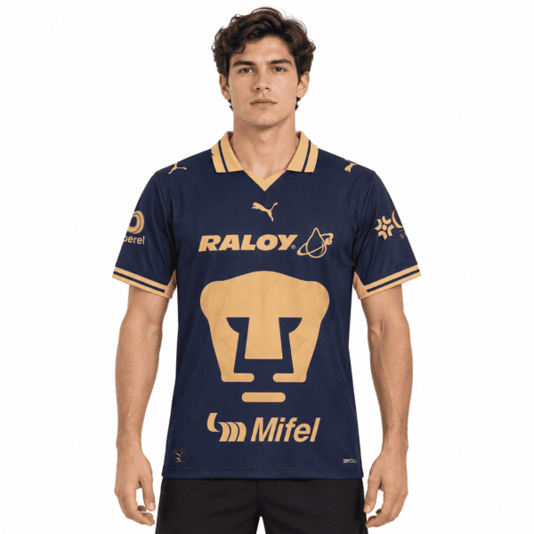 ba3877d2-0b49-41a5-b26b-e743a731a670 - UAE SPORT STORE Pumas UNAM home jersey 26/27 with navy and gold colors, Puma logo, and sponsor logos.