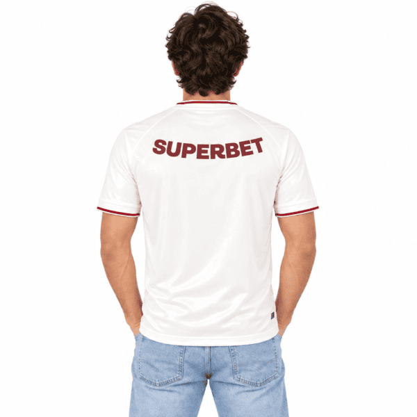 Back view of a white football jersey with 'SUPERBET' in maroon text.