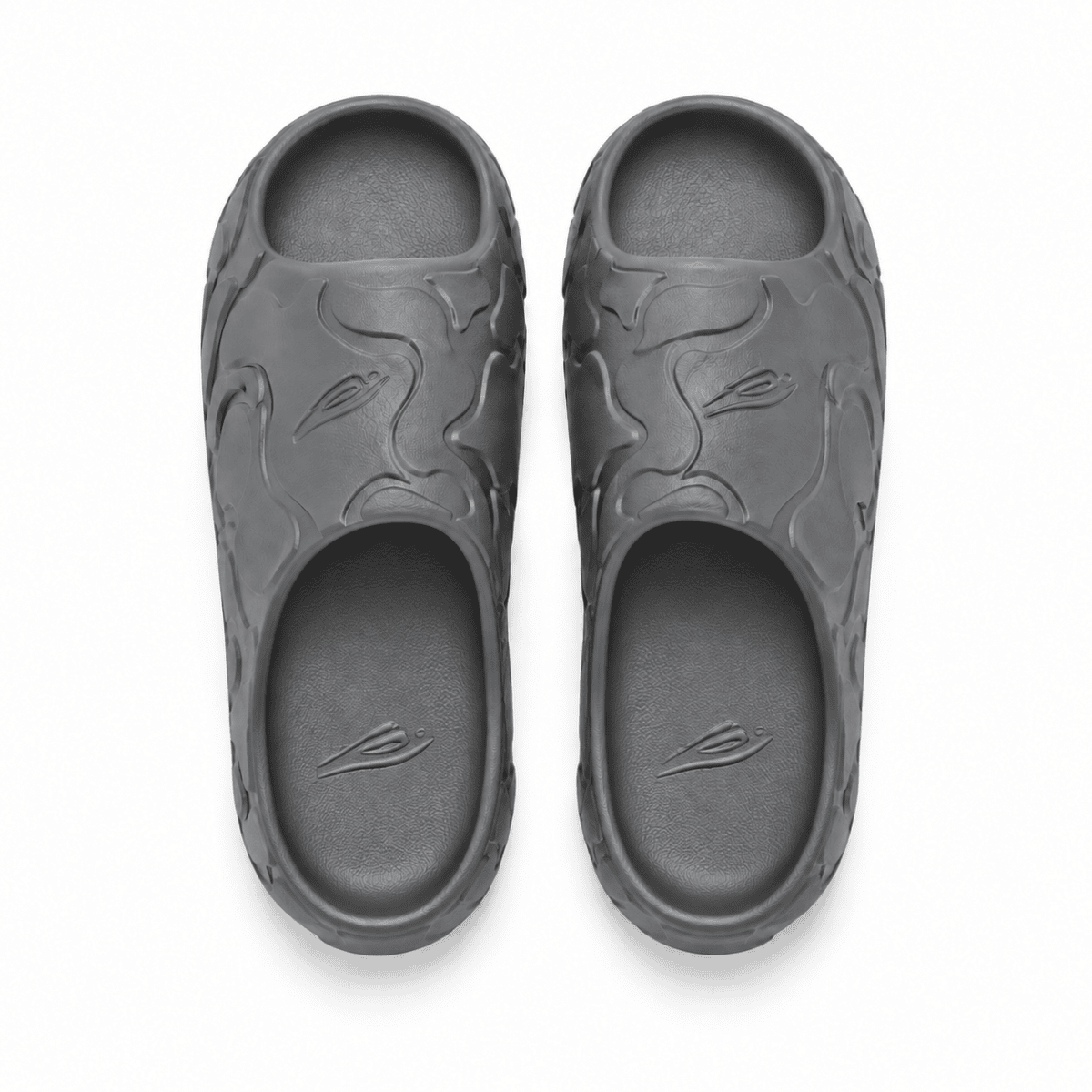 Grey Bape Slides with embossed logo and textured design.