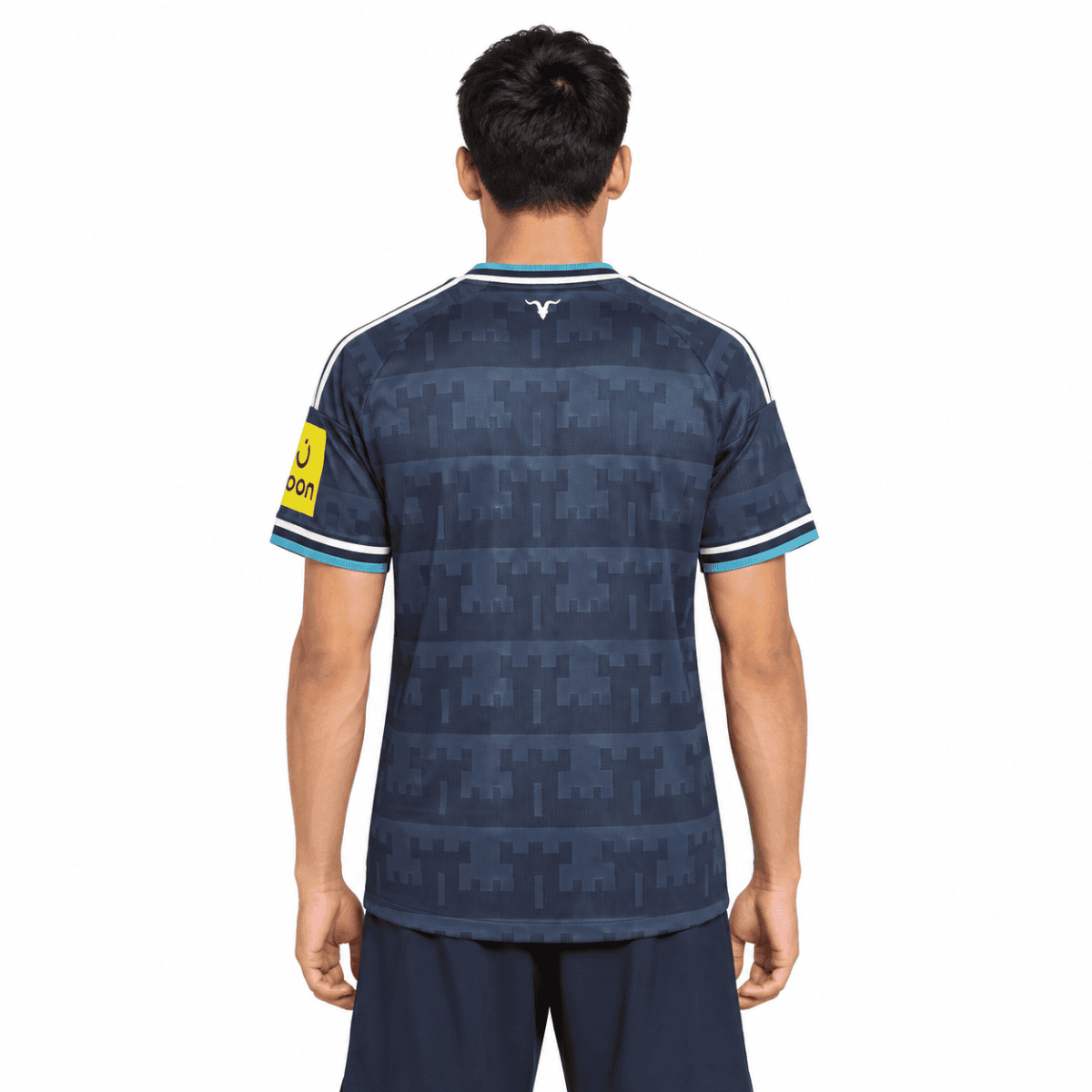 Newcastle away jersey 2026/27 with blue camouflage pattern, short sleeves, and club logo.