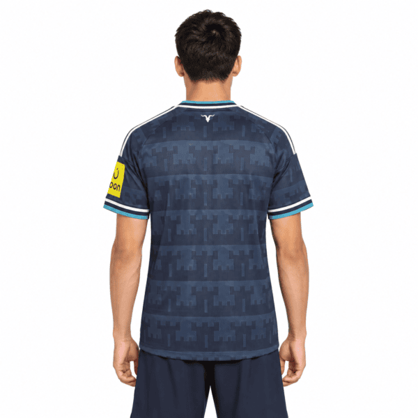Newcastle away jersey 2026/27 with blue camouflage pattern, short sleeves, and club logo.