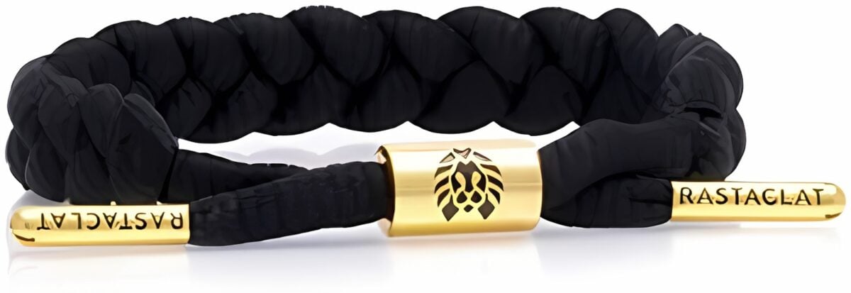 Black braided bracelet with gold accents and lion emblem.
