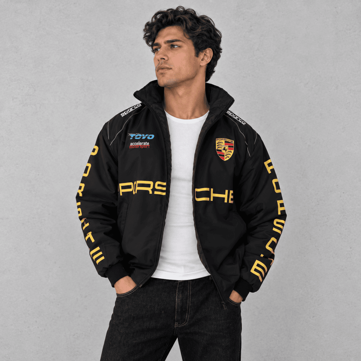 Porsche racing jacket with black and yellow design and Porsche logo.