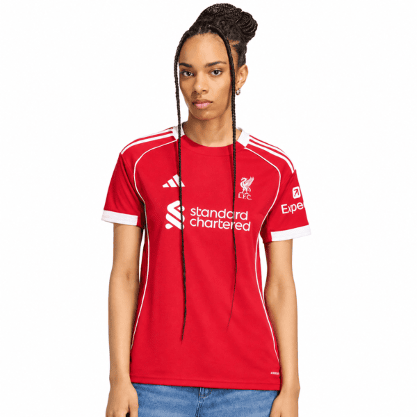 c0a8e8d0-e431-4785-8bb6-6d30ad3ab926 - UAE SPORT STORE Liverpool Women home jersey 2025/26 red kit with white accents and sponsor logos.