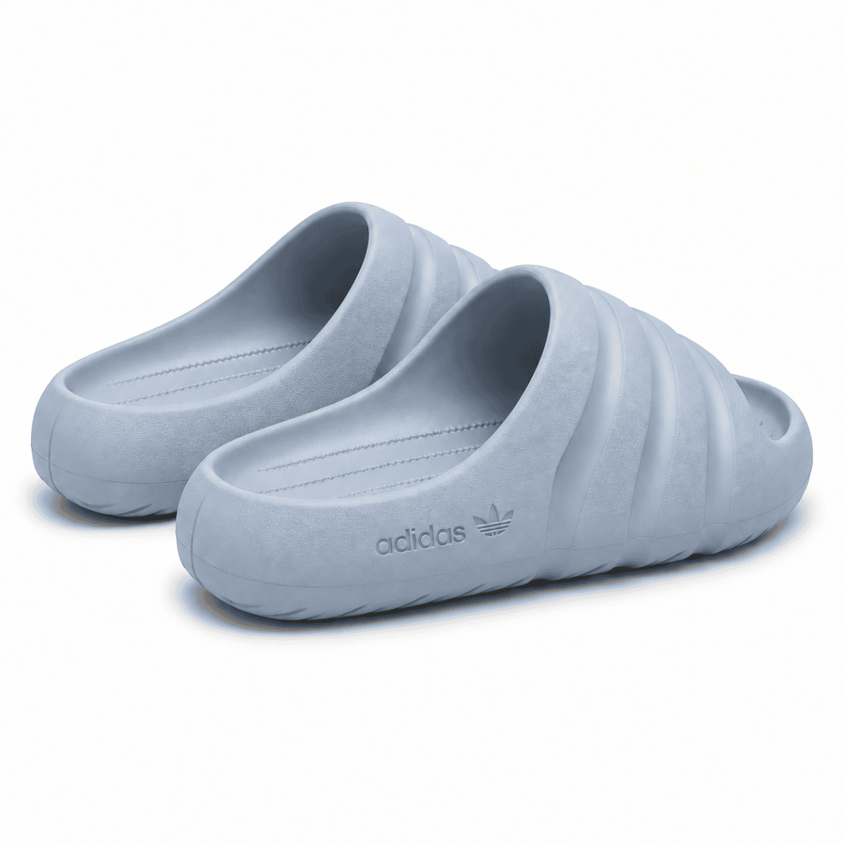 Light blue Adidas Adilette Ayoon Slides x Bad Bunny slides on white background.