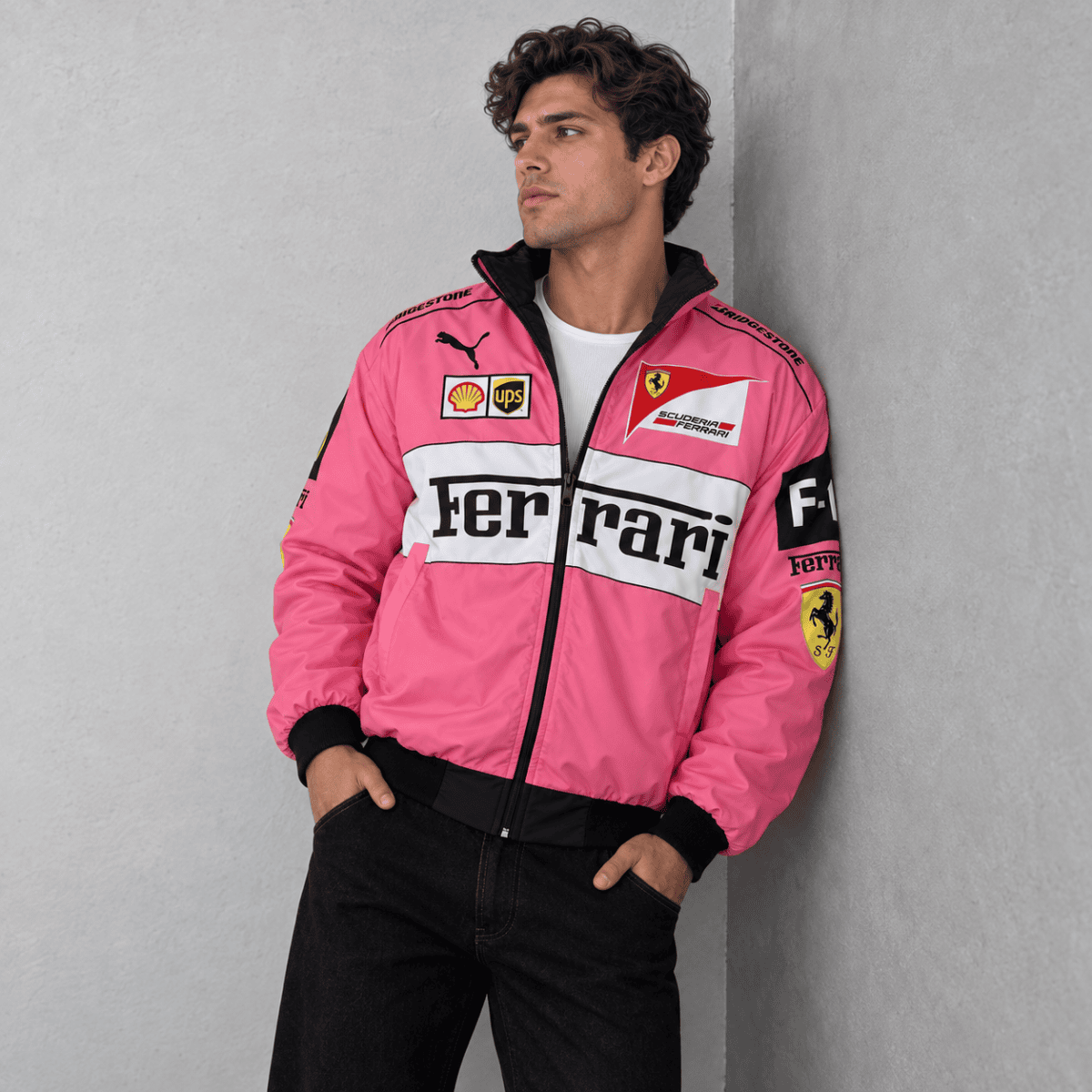 Man wearing pink Ferrari Formula 1 team jacket with sponsor logos.