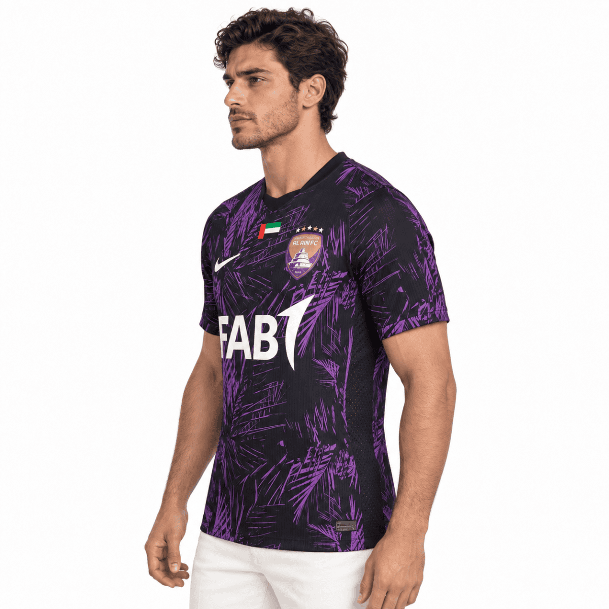 Football jersey of Al Wahda FC with purple and black design, season not specified.