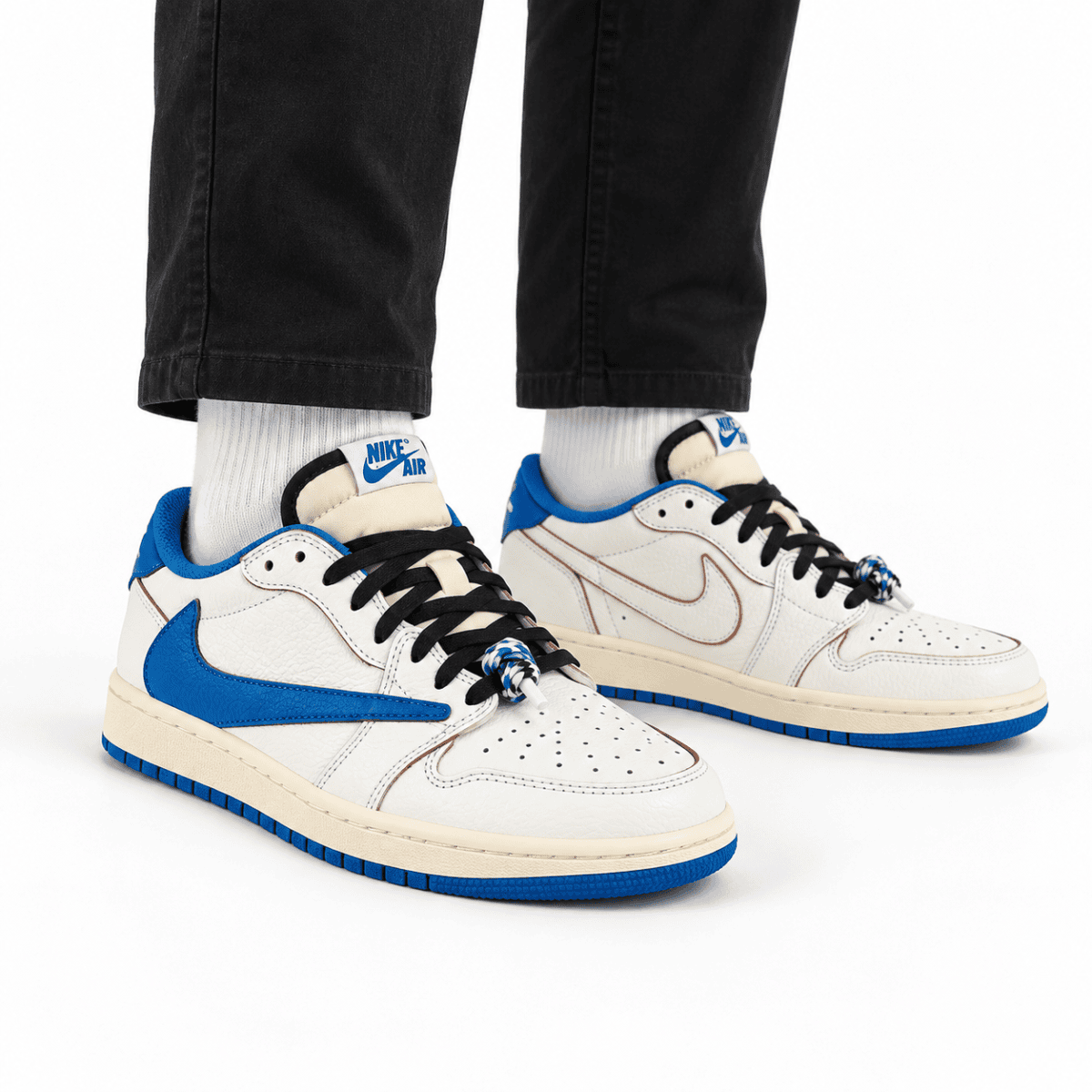 Nike Air Jordan 1 Low OG sneakers in sail and military blue colors.