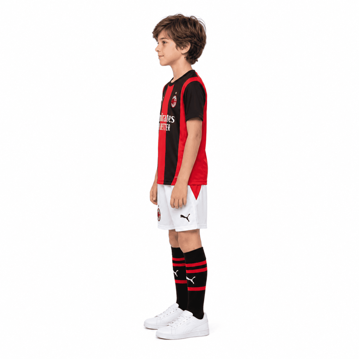 AC Milan kids home kit 2026/27 with red and black jersey, white shorts, and black socks.