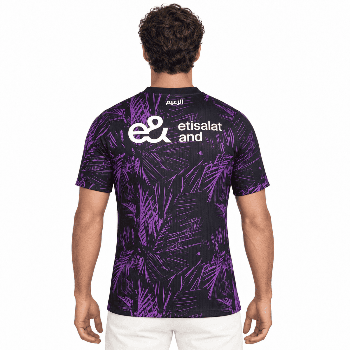 Black and purple football jersey with palm leaf pattern and Etisalat logo.