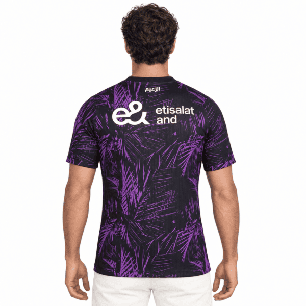 Black and purple football jersey with palm leaf pattern and Etisalat logo.