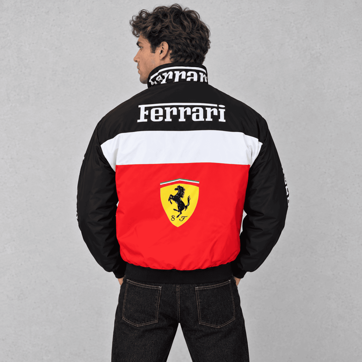 Ferrari branded jacket with red, white, and black colors and Ferrari logo on back.