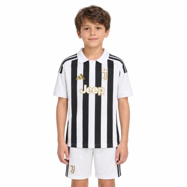 Juventus Home Kit Kids 202627 black and white striped jersey with white shorts front view - UAE SPORT STORE Juventus Home Kit Kids 2026/27 black and white striped jersey with white shorts front view