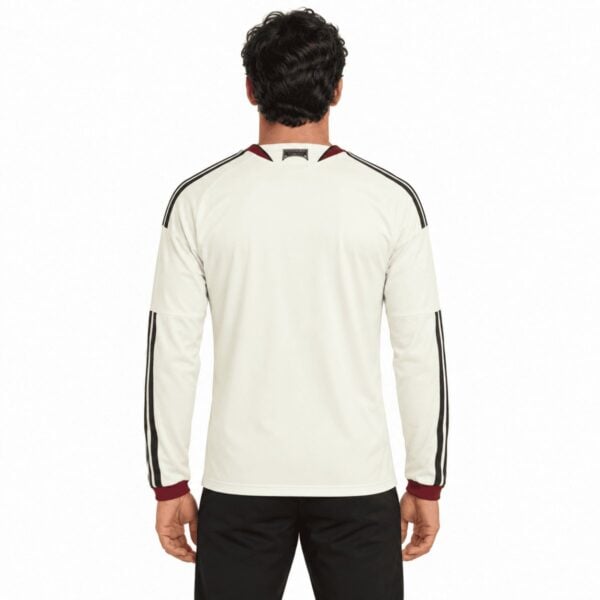 Manchester United Third Long Sleeve Jersey 2026/27 back view in cream with black sleeve stripes