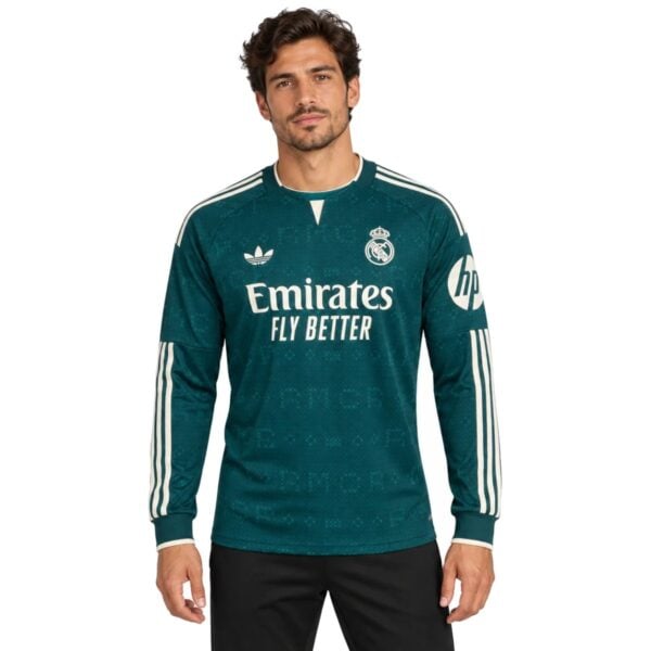 Real Madrid Away Long Sleeve Jersey 202627 deep teal front view with Emirates Fly Better - UAE SPORT STORE Real Madrid Away Long Sleeve Jersey 2026/27 deep teal front view with Emirates Fly Better