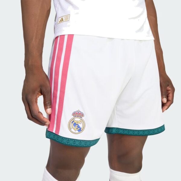 Real Madrid Home Short 2026/27 close-up of club crest and pink Three Stripes - UAE SPORT STORE Real Madrid Home Short 2026/27 close-up of club crest and pink Three Stripes