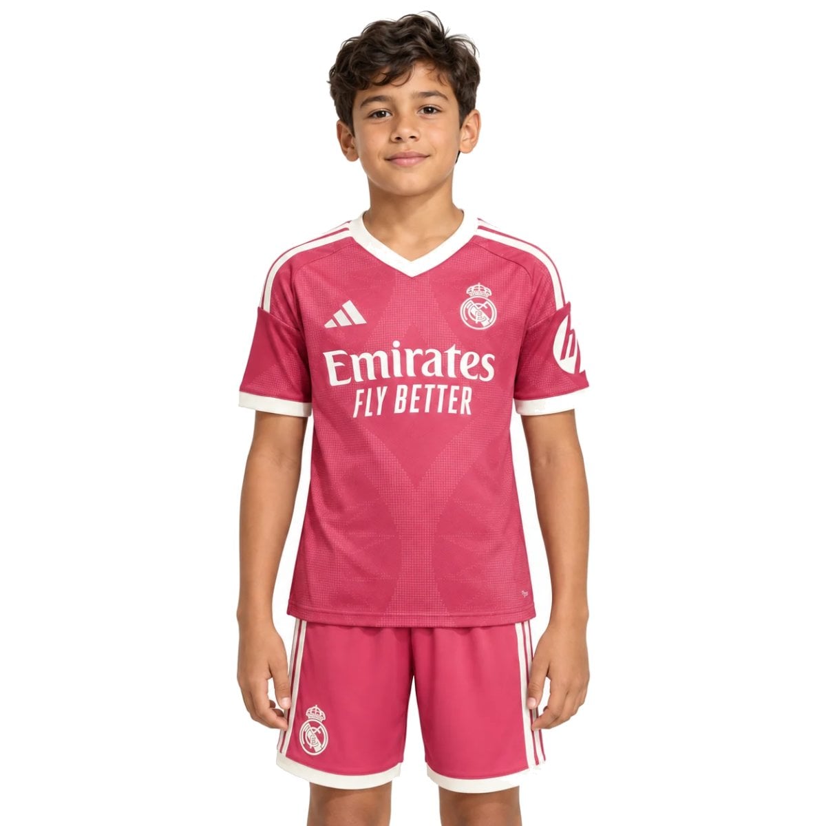 Real Madrid Third Kids Kit 202627 pink jersey and shorts front view with Emirates Fly Better - UAE SPORT STORE Real Madrid Third Kids Kit 2026/27 pink jersey and shorts front view with Emirates Fly Better