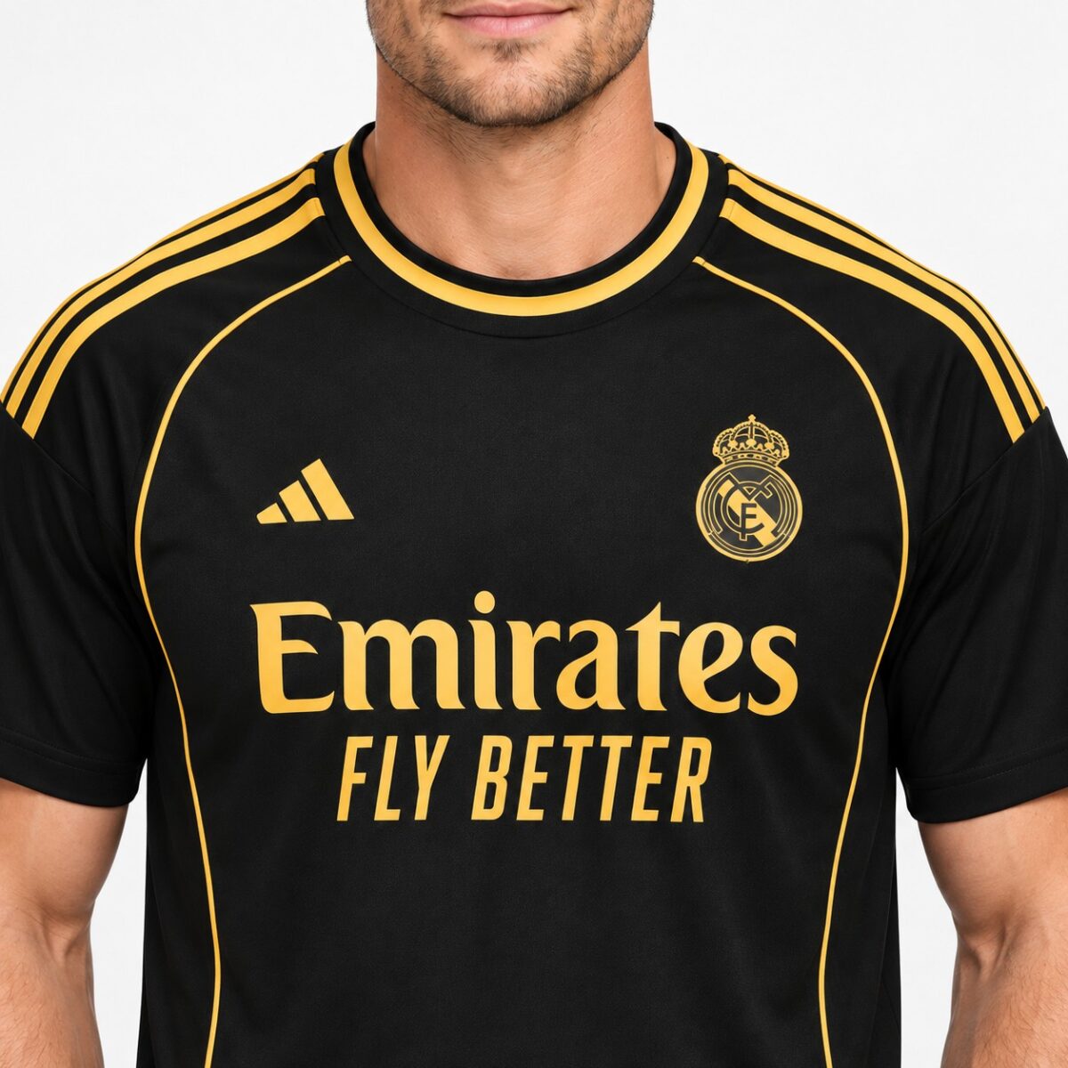 Real Madrid away kit jersey with black and gold colors, season not specified.