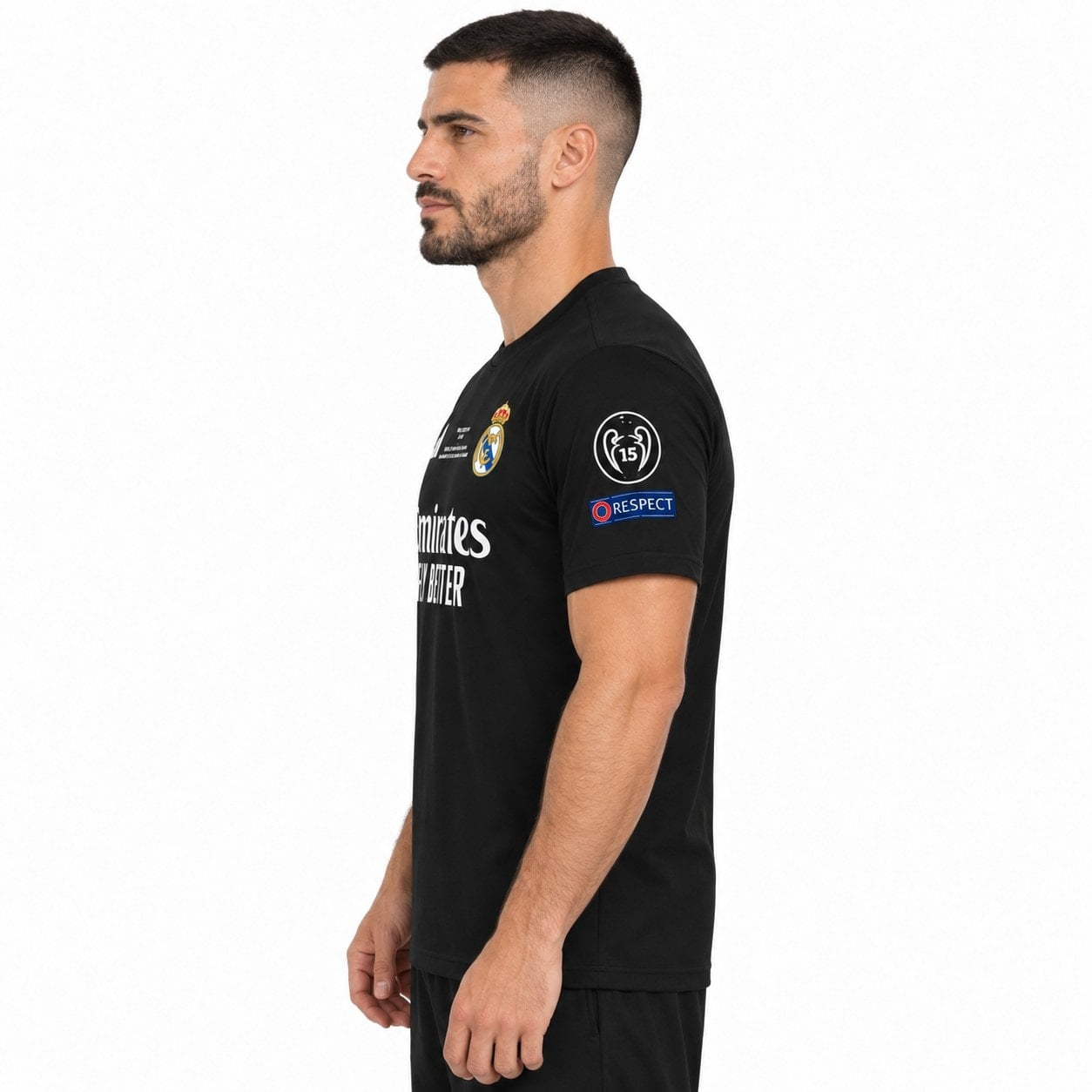 rm-black-special-edition-3 - UAE SPORT STORE Model side view of a black Real Madrid shirt with white chest lettering.