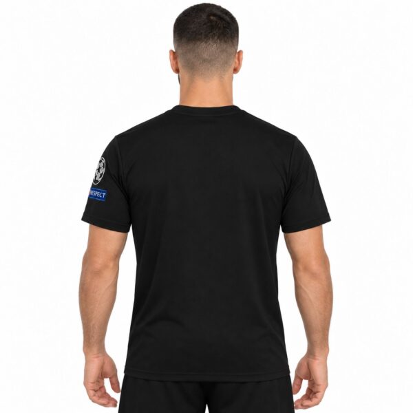 Black football jersey with UEFA Champions League patch on sleeve, back view.