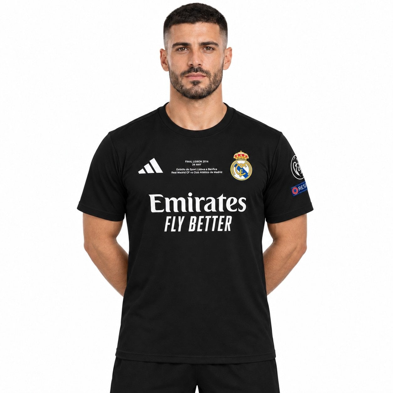 rm-black-special-edition-6 - UAE SPORT STORE Model front view of a black Real Madrid shirt with white chest lettering.