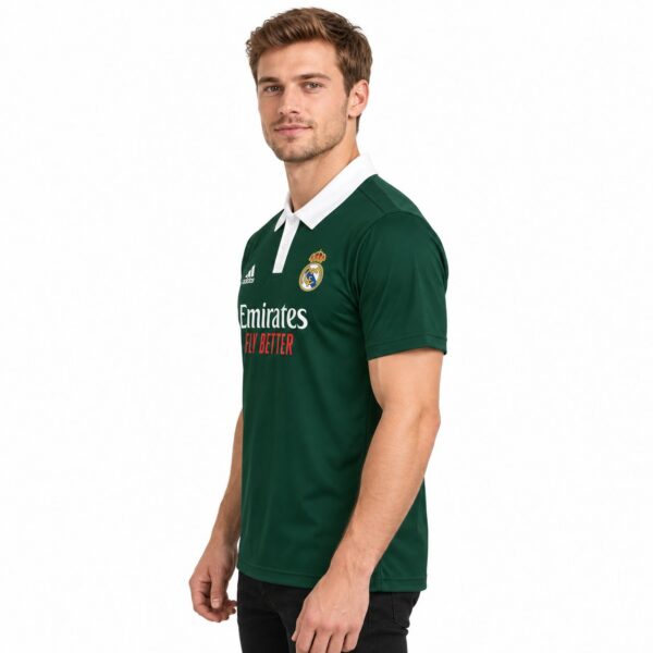 Real Madrid home football jersey green with white collar and logo.