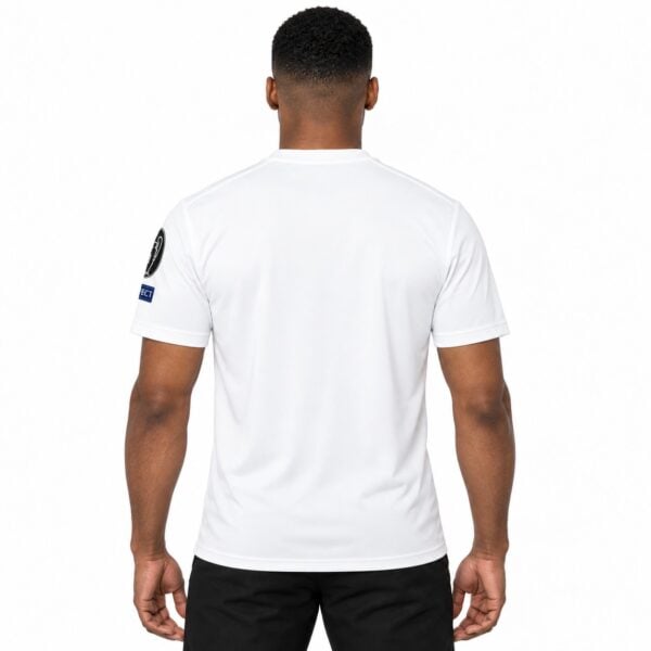 Back view of a plain white football jersey with UEFA patch on sleeve.
