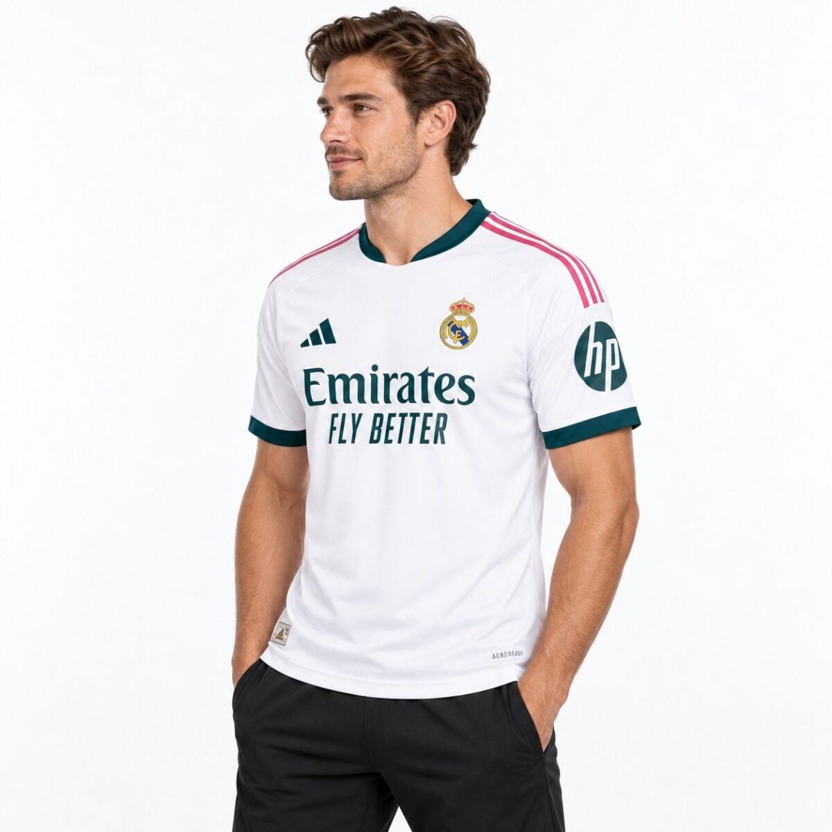 Real Madrid away kit jersey with white, pink, and teal colors, season not specified.