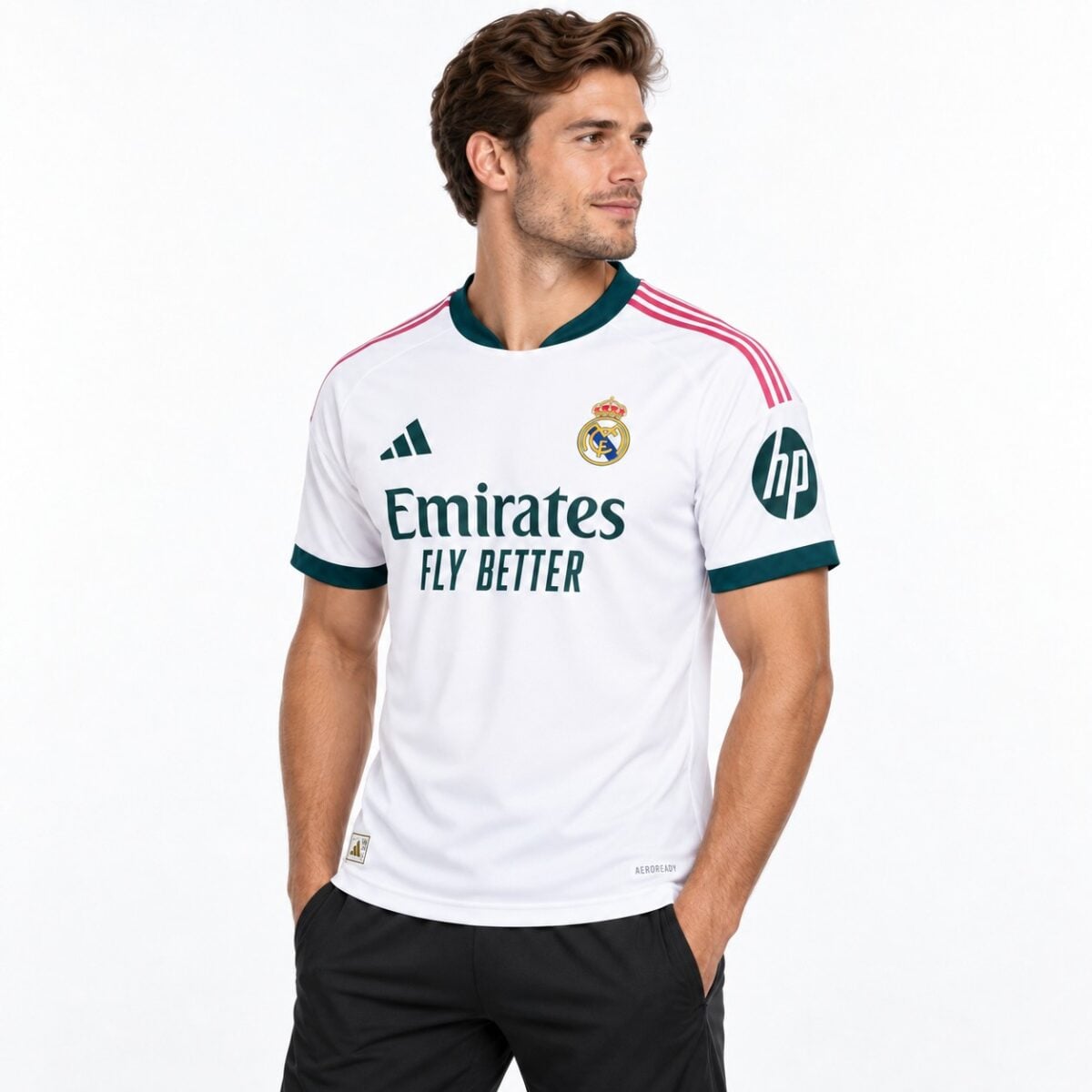 Real Madrid away football jersey white with pink and green accents, 2023 season.