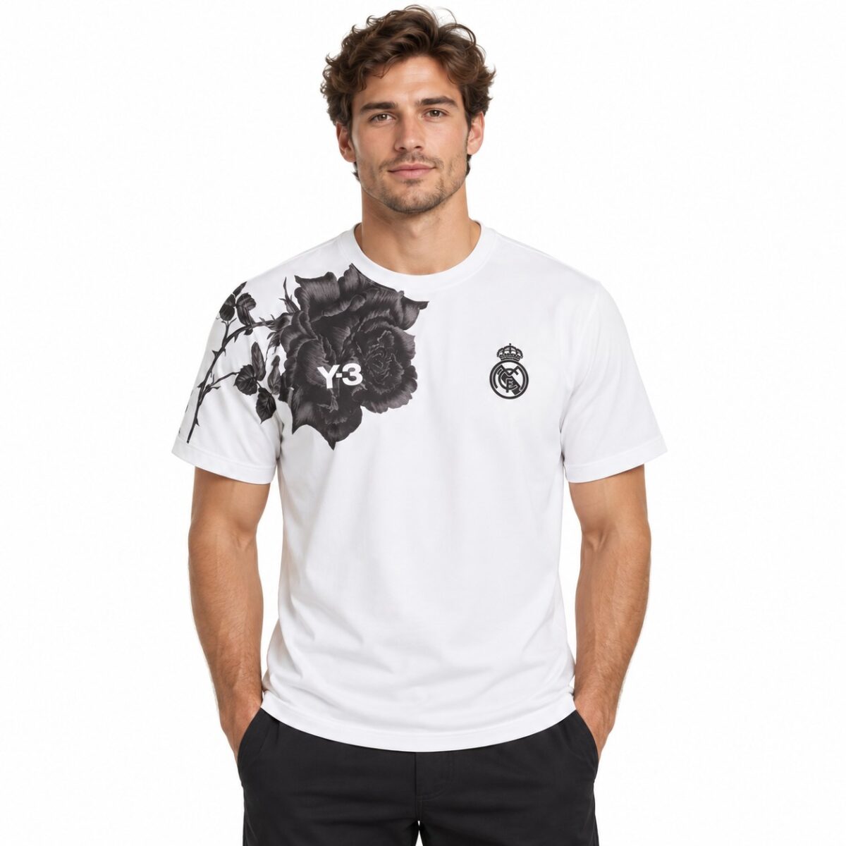 Real Madrid white home jersey with black floral design and club crest.