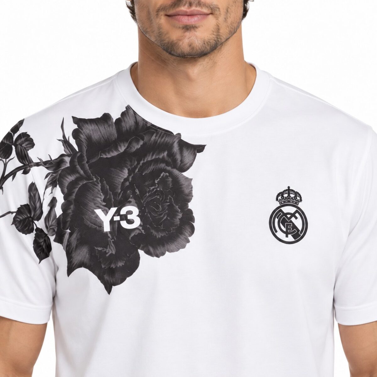 Real Madrid white jersey with black floral design and club crest.