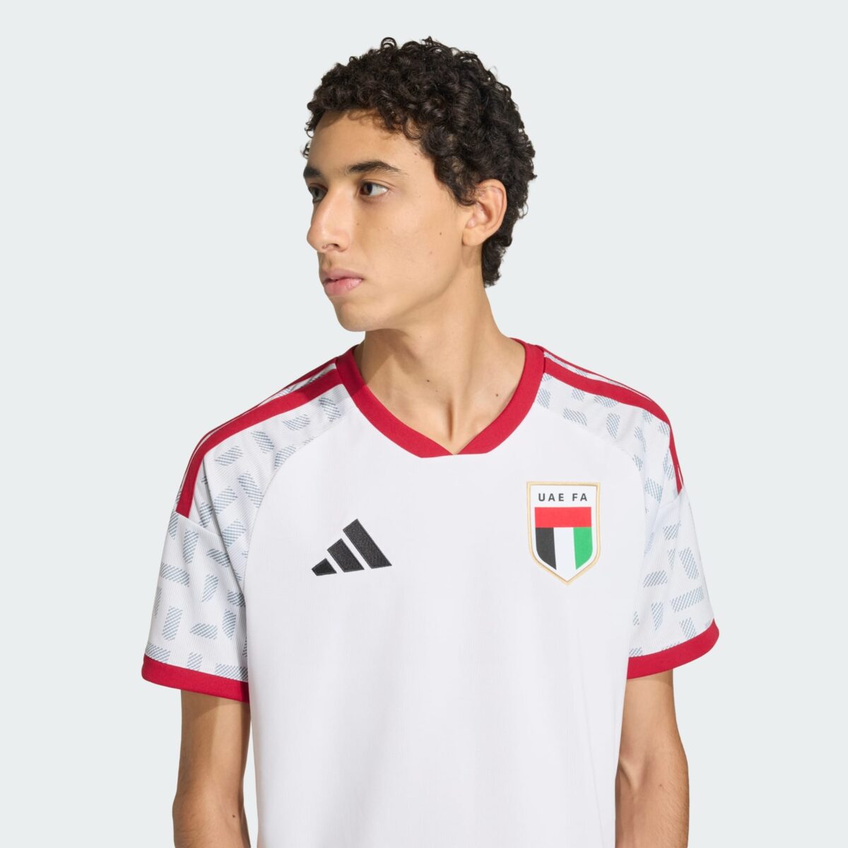 UAE national football team jersey with white, red, and black colors and UAE FA logo.