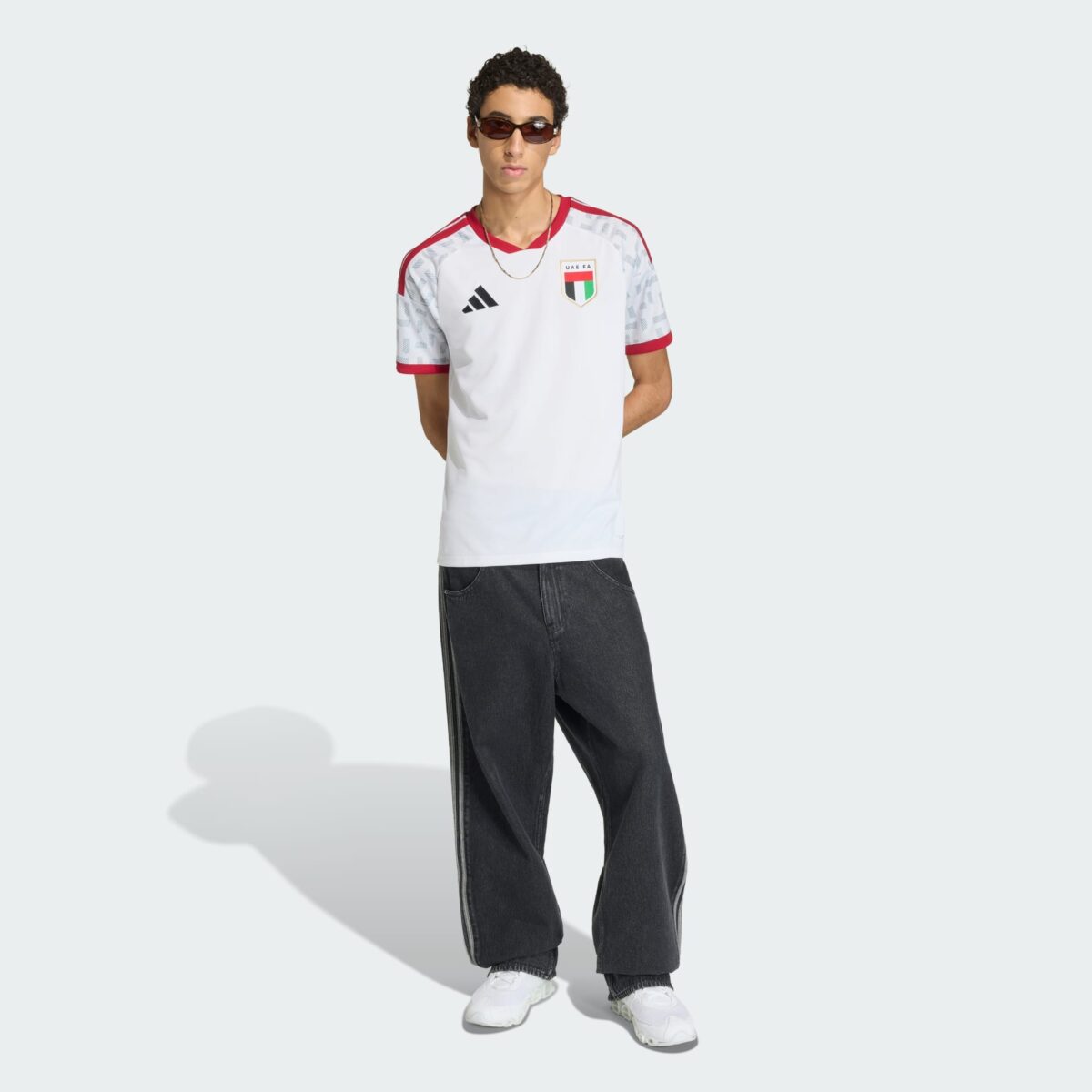 Italy national team football jersey, home kit, white with red and black accents.