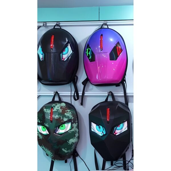 Four colorful children's helmets with animal and superhero designs on display.