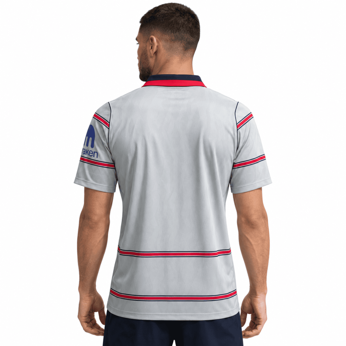 Atletico Madrid third jersey 2026/27 with red and blue stripes, back view.