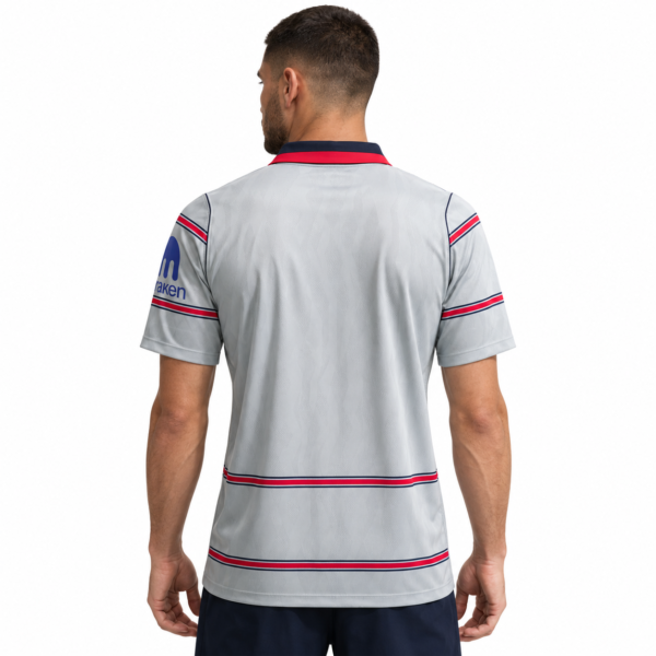 Atletico Madrid third jersey 2026/27 with red and blue stripes, back view.