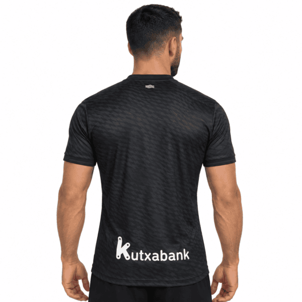 Real Sociedad away jersey 2026/27 in black with sponsor logo on back.