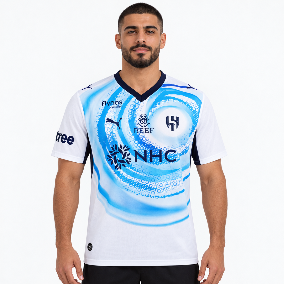 Football player in white and blue Al Hilal away jersey 2026/27.