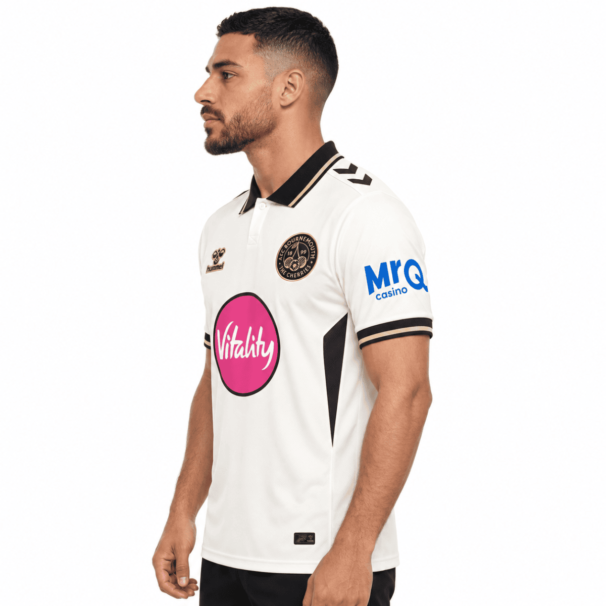 A man wearing a white AFC Bournemouth third football jersey with black and gold accents.