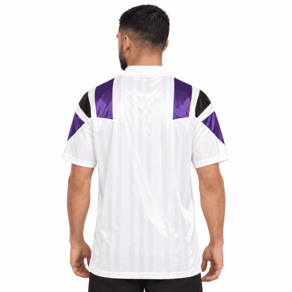 White football jersey with purple and black accents, back view.