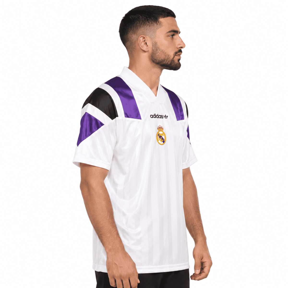 Real Madrid home football jersey with purple and black accents, white base, and club crest.