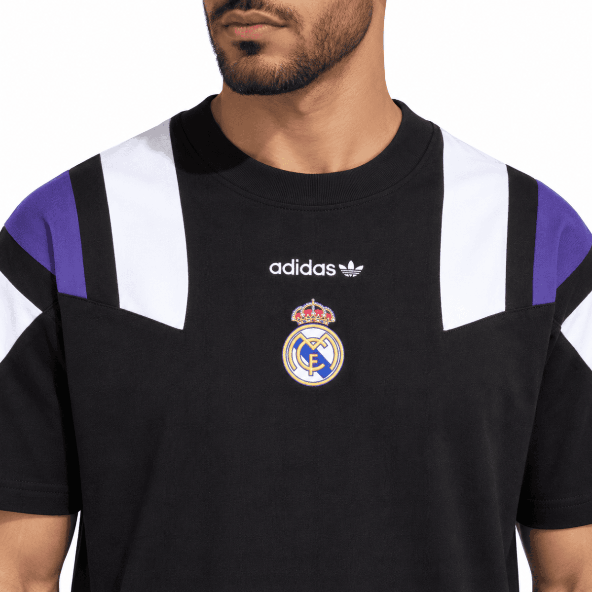 Black Real Madrid football jersey with white and purple accents, Adidas logo, and club crest.