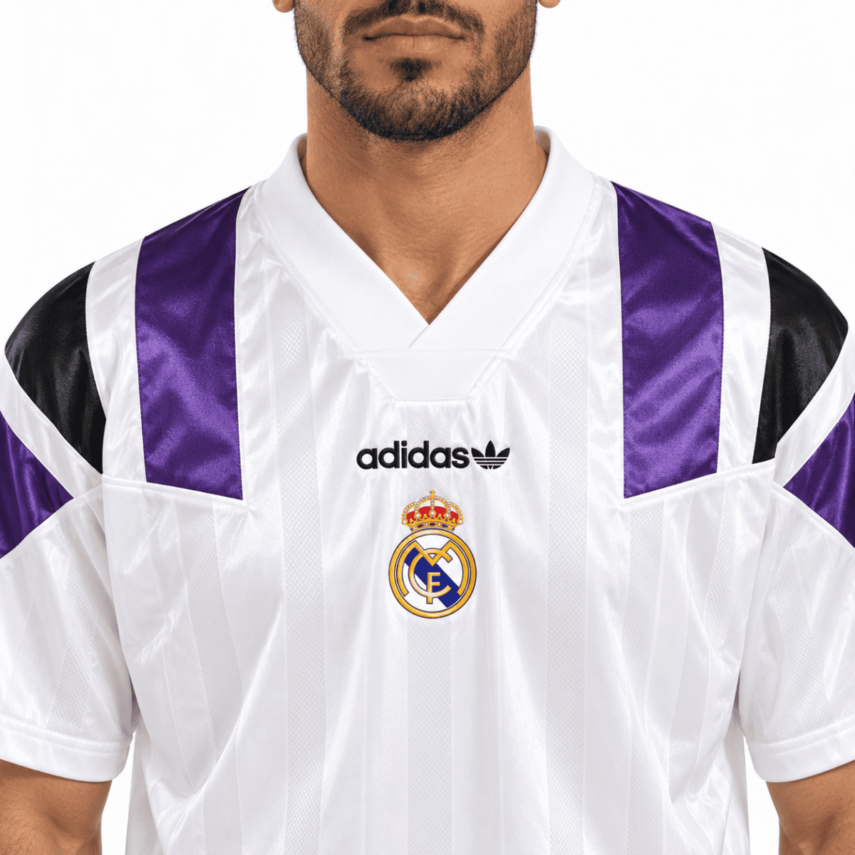 Real Madrid football jersey with white and purple colors, Adidas logo, and club crest.