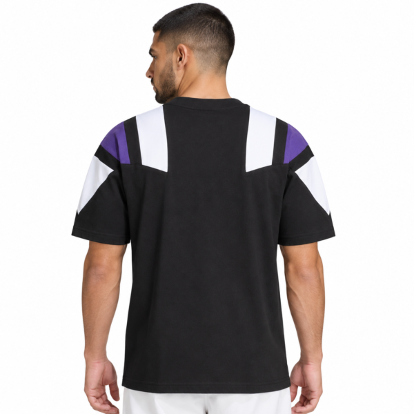 Black football jersey with purple and white shoulder accents, back view.