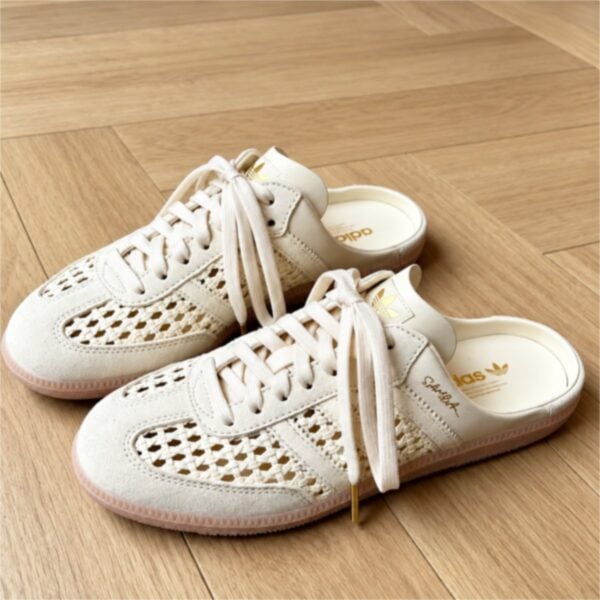 adidas Samba Mule ivory pair on wood floor showing the basket weave upper and gold trefoil heel tab