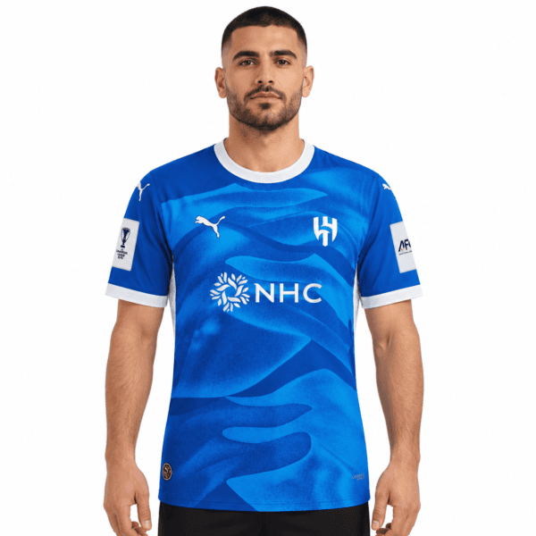 Al Hilal home football jersey 2026/27 in blue with white accents and sponsor logo.
