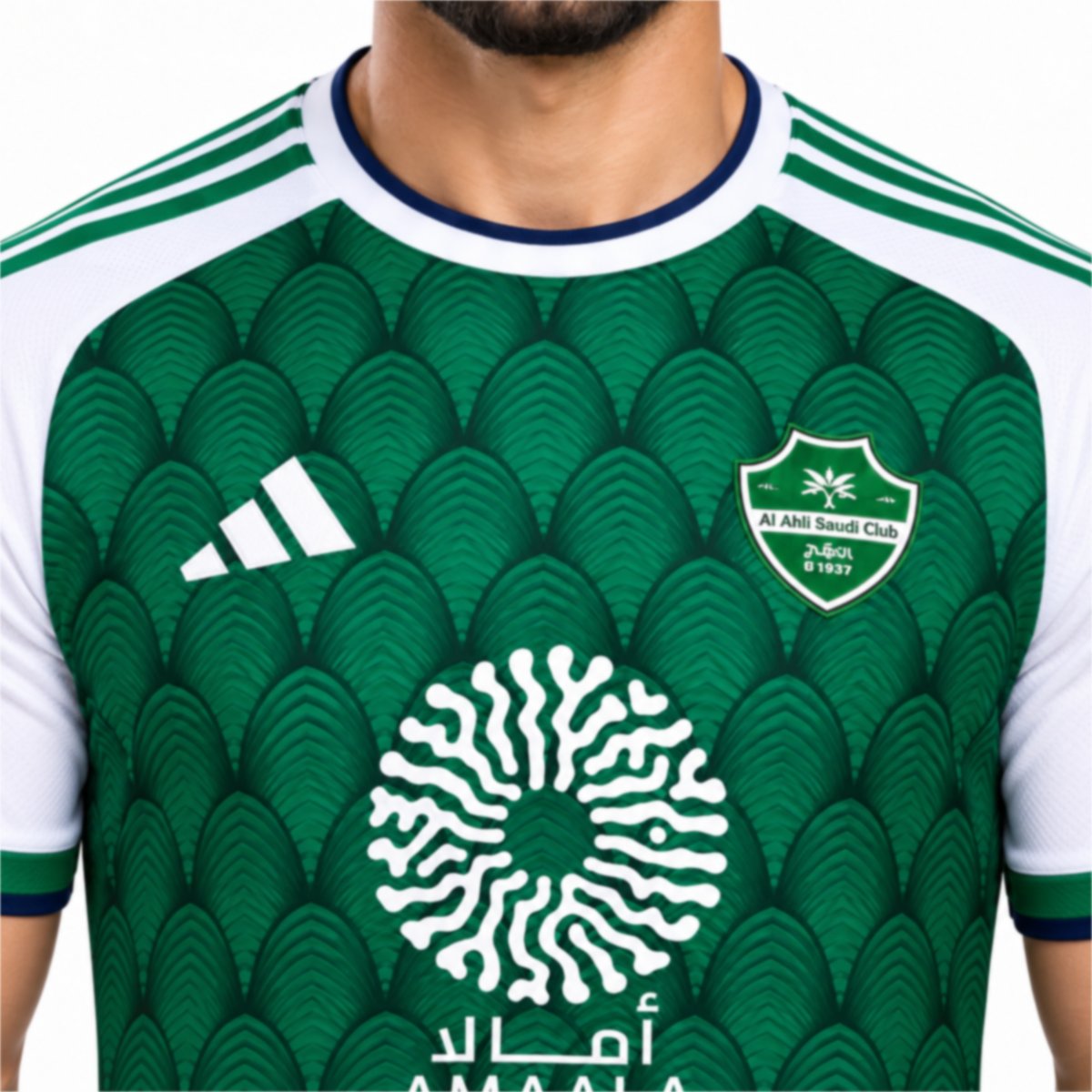 Al Ahli Saudi home jersey close-up of the club shield white collar with navy trim and arch pattern - UAE SPORT STORE Al Ahli Saudi home jersey close-up of the club shield white collar with navy trim and arch pattern