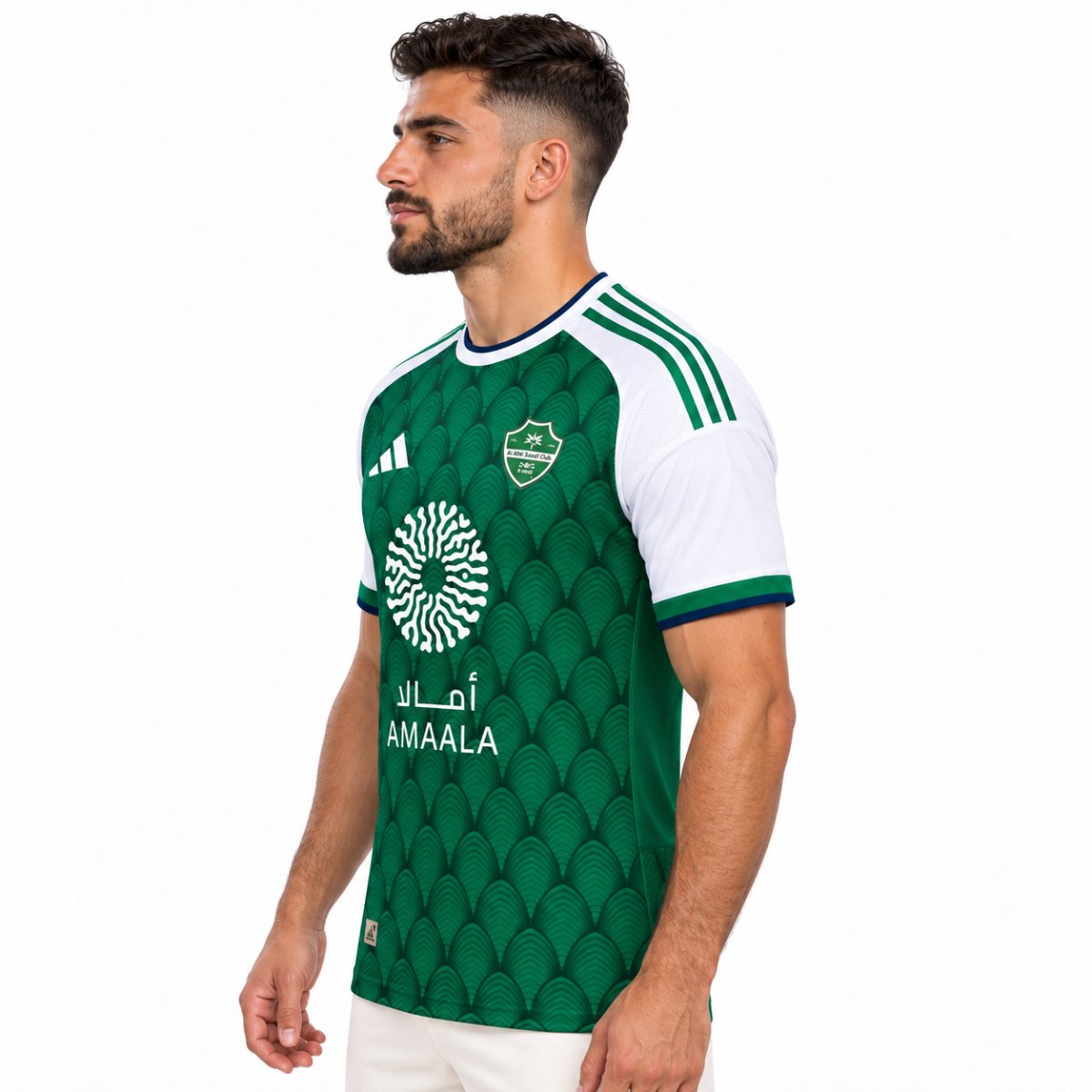 Al Ahli Saudi home jersey side angle showing white raglan sleeve with green stripes - UAE SPORT STORE Side view of the green Al Ahli shirt with white sleeves, white AMAALA lettering and repeated arch patterns.