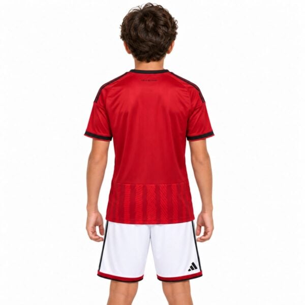 Al Ahly home kids kit back view red jersey with black shoulder stripes and white shorts