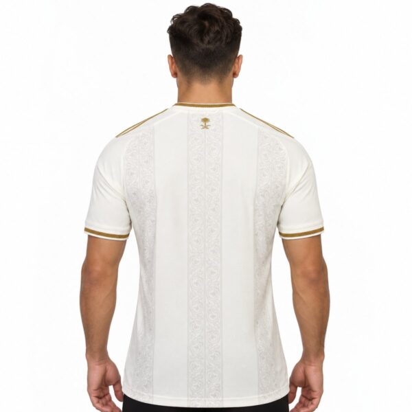 Al Nassr third jersey back view off white with arabesque bands and Saudi palm and swords emblem at the neck